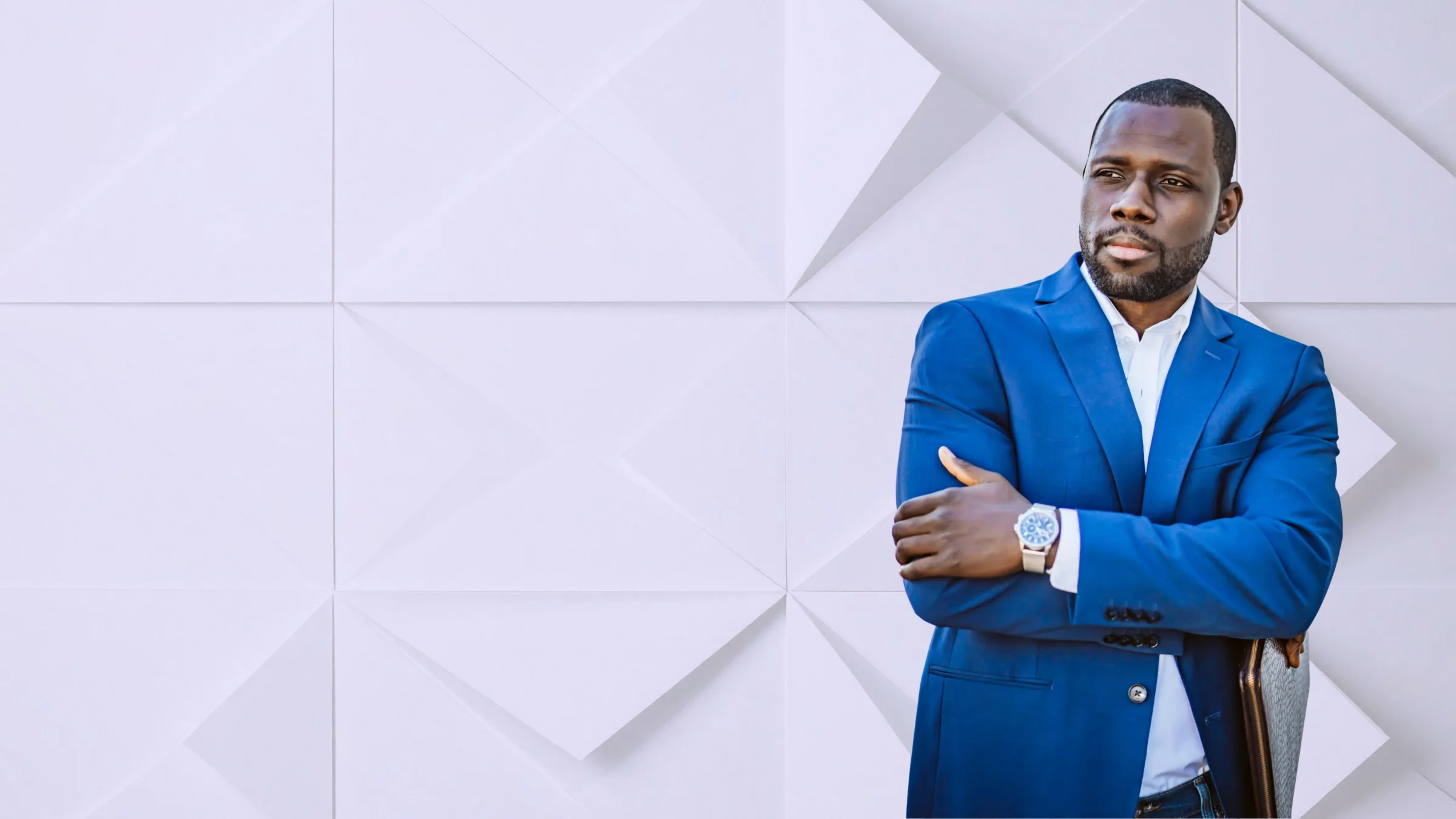 Portrait of a business executive in a blue suit, representing African corporate leadership